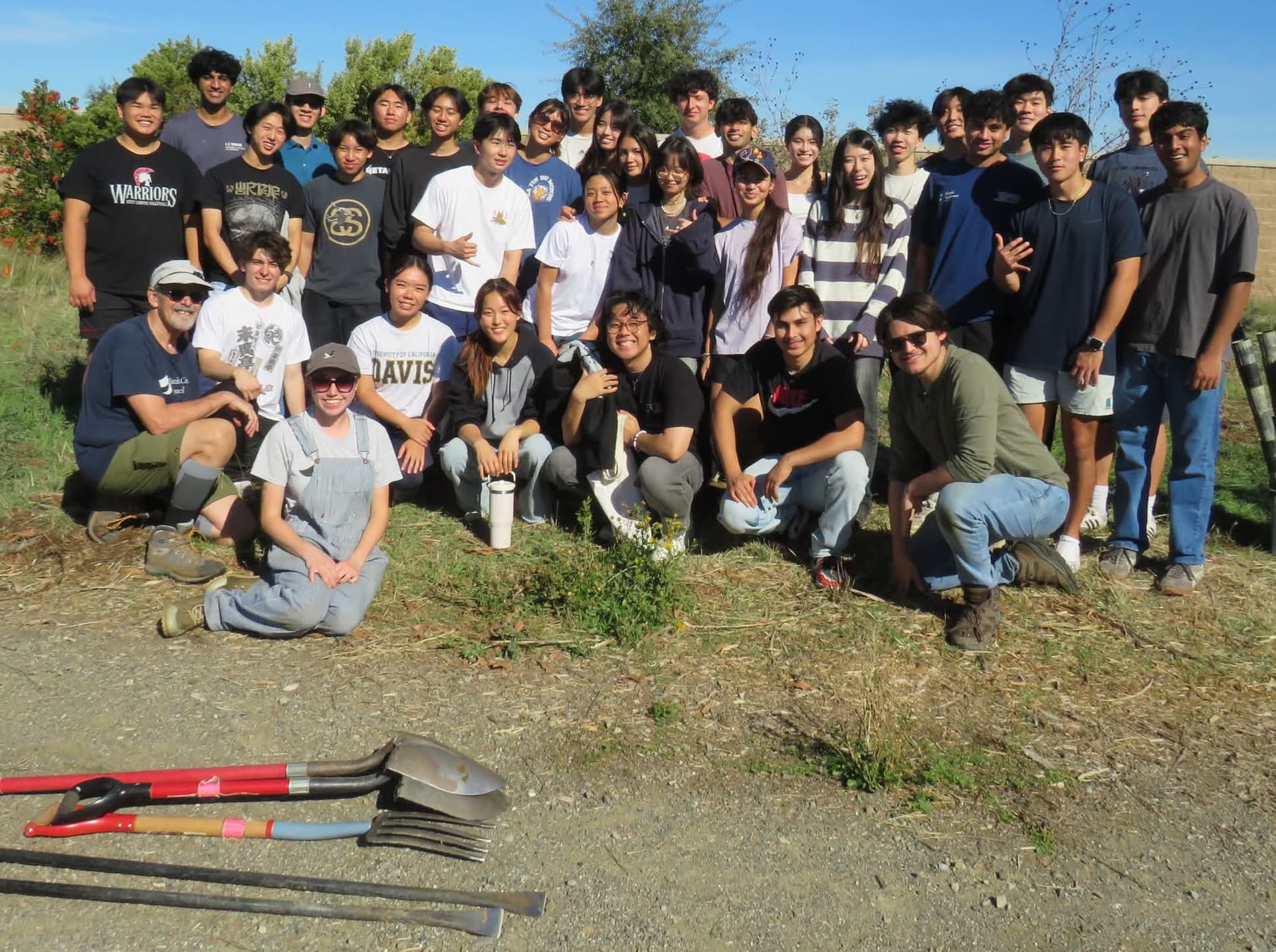 DUEN officers volunteering to do a park cleanup!